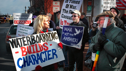A pro-war demonstrator, left, confronts the peace movement in West Chester, PA. Photo by John Grant